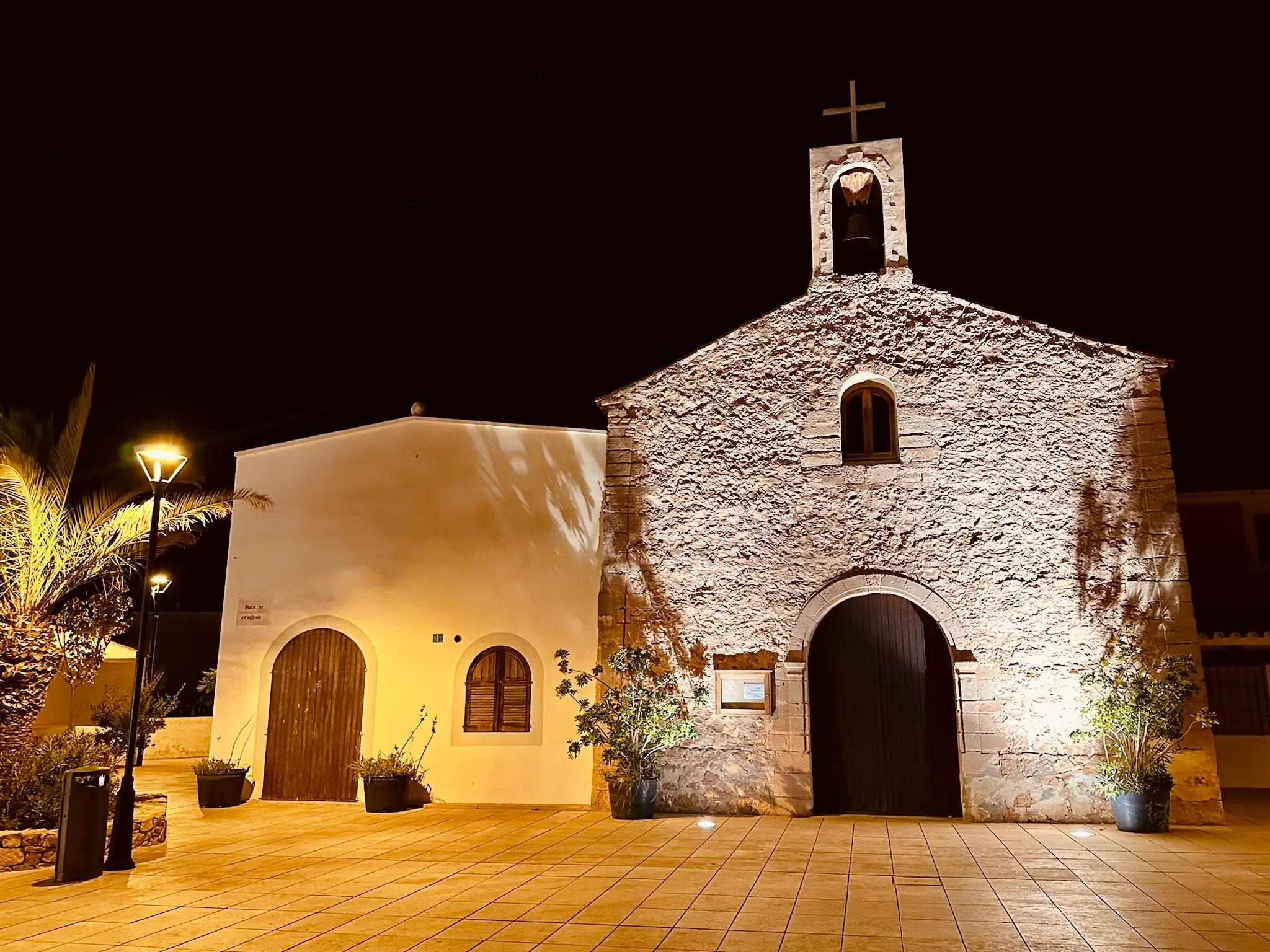 The Church of Sant Ferran de ses Roques in Sant Ferran’s main square in Formentera, beautifully illuminated at night.